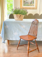 Classic block print table linen with lavender in a french market tote